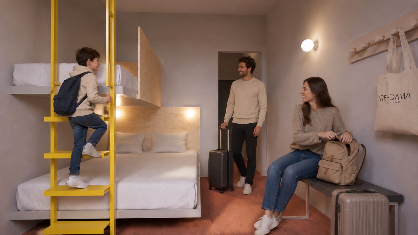 Una habitación con literas, una maleta, un banco y un perchero de pared.