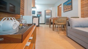 A modern kitchen with a refrigerator, microwave, and a chalkboard sign. - Beautiful apartment in Copacabana near the beach. (Rio de Janeiro)