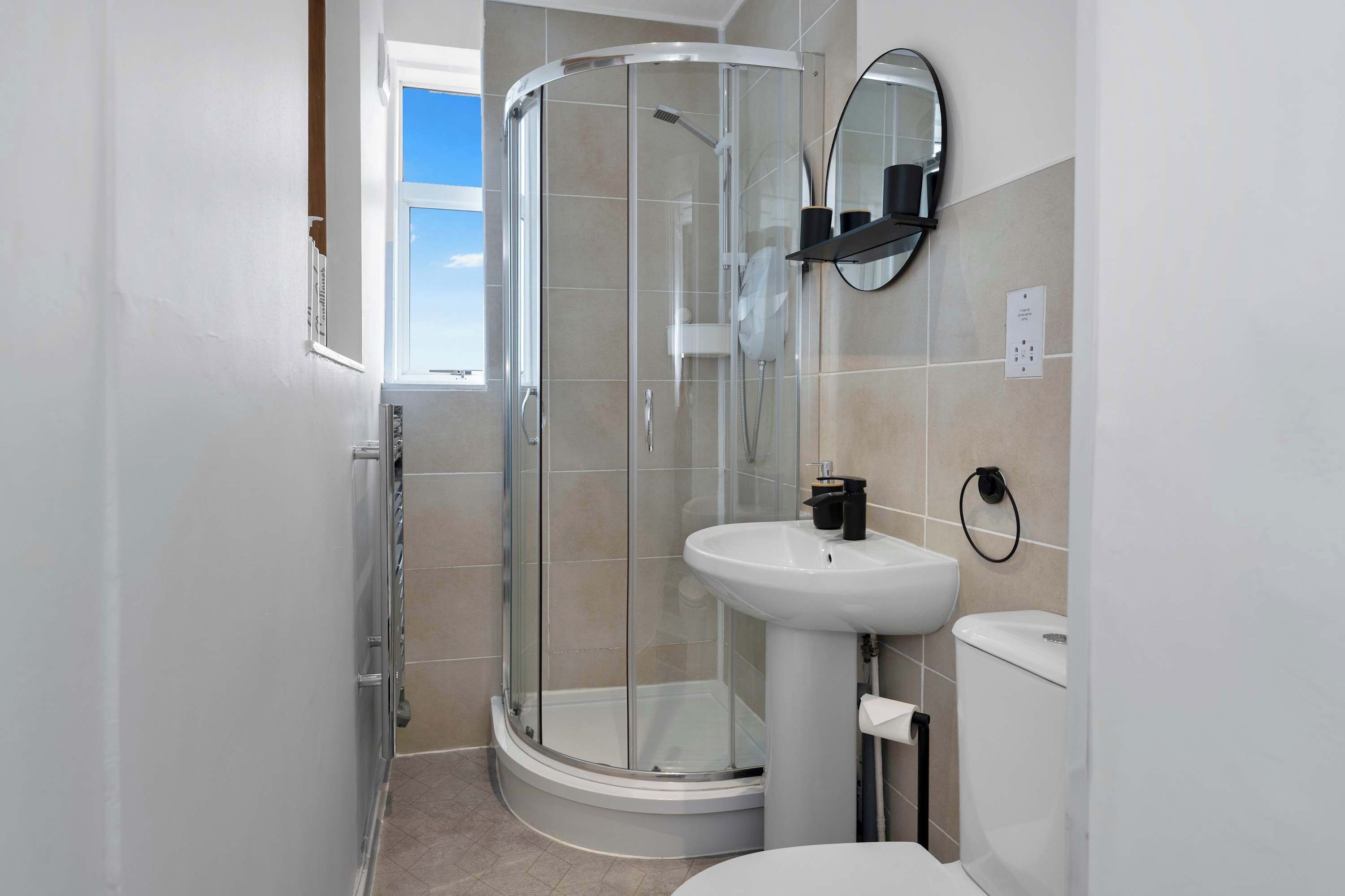 Shower, hair dryer, towels, shampoo