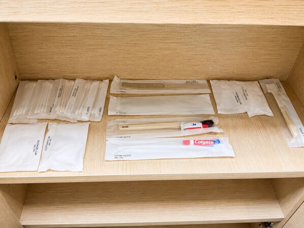 A drawer with various personal care items neatly organized.
