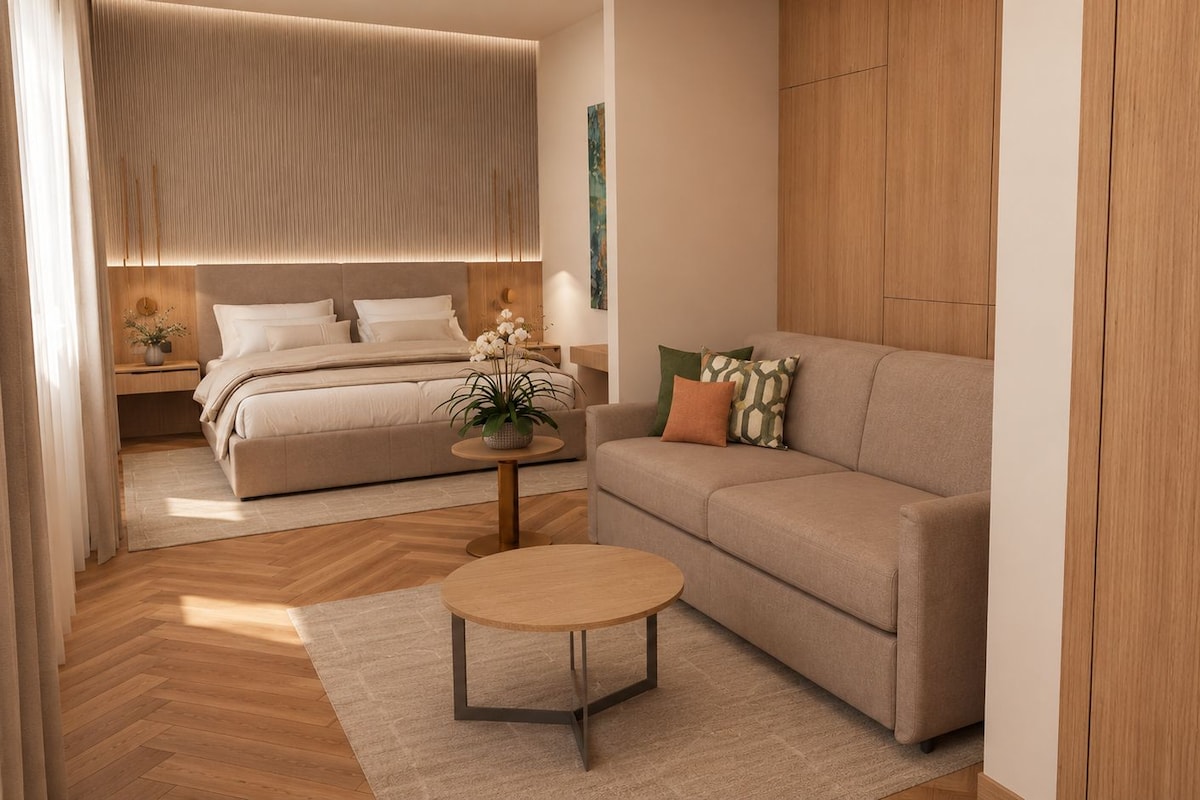 A modern bedroom with a bed, bedside table, and a nightstand.