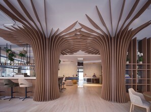 A modern interior with a unique wooden archway, a bar area, and seating. - The Benedict Hotel Old Town Prague (Prague)