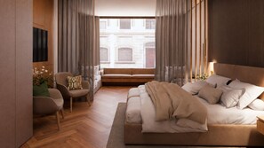 Un dormitorio moderno con una cama grande, una zona de estar con una silla y sofá, y vistas de un edificio a través de una ventana.