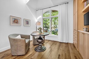 A room with a dining table, a chair, a lamp, and a window with curtains. - North Boulder Elegance - Newlands Neighborhood (Boulder)