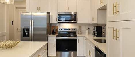 Coffee/tea maker, fridge, microwave, oven