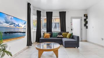 Family Apartment, 3 Bedrooms, Kitchenette | Living area | 42-inch Smart TV with digital channels