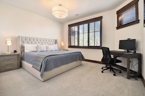 A bedroom with a bed, bedside tables, a desk, and a computer. - Silver Star 802 | Ski-in/Out | Hot Tub (Park City)