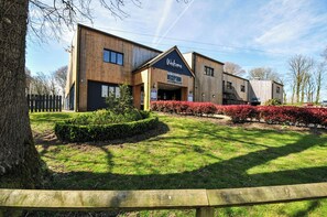 A modern building with a reception area and a sign that says 'Welcome'. - No.122 Hengar Holiday Park (Bodmin)