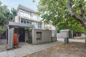 A modern two-story residential building with a balcony, a covered entrance, and a mailbox. - The Dandy Relaxed Living near St Kilda Beach and CBD (Caulfield North)