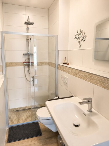 Spacious 60 m² vacation rental with 2 balconies, lake views, right on the water, and a boat dock
