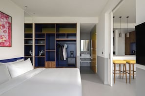 A modern hotel room with a large bed, a walk-in closet, a bathroom, and a kitchenette. - Wink Hanoi Westlake, Unscripted by Hyatt - 24 Hours stay (Hanoi)