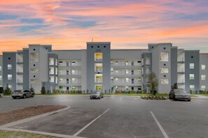 A multi-story building with a flat roof, numbered 3141, featuring a central entrance and multiple balconies. - Lake View 3BR/2BA • Themed Rooms SL31418 (Kissimmee)
