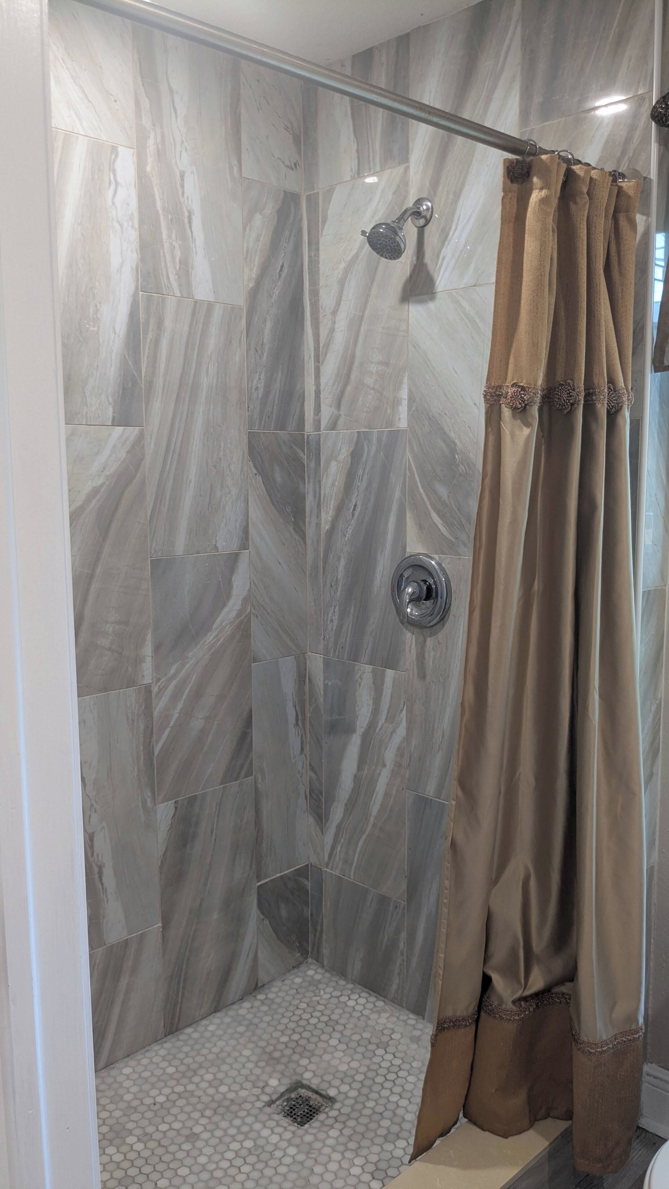 Shower, towels, soap, toilet paper