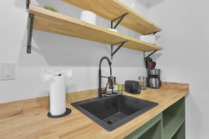 Everyday rituals elevated by organic wood tones and refined, modern fixtures.