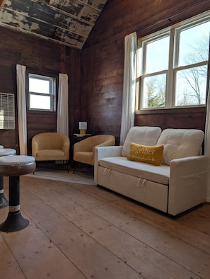 Living area - The Guest House by The Trestle, Quaint and Cozy cabin made with reclaimed wood (Arthur)