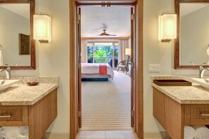 A hotel room with a large bed, a ceiling fan, and a view of the outdoors. - Hyatt Residence Club-Breathtaking 2 BR Beach-Front Villa!  Guaranteed Top Floors (Lahaina)