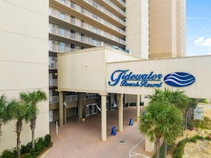 A hotel entrance with a sign reading 'Tidewater Beach Resort.' - Tidewater (Panama City Beach)