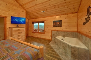Master Bedroom with King Bed, Jacuzzi, and TV - Majestic Splash Cabin Rental (Wears Valley)