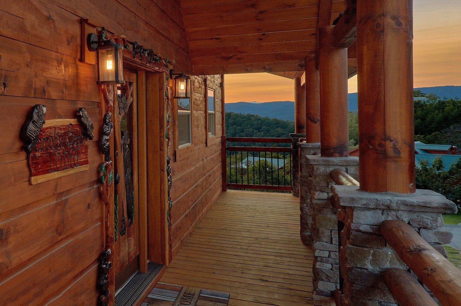 A wooden cabin with a balcony overlooking a mountainous landscape.
