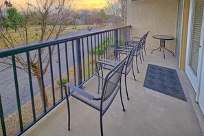 A balcony with a metal railing, a small round table, and two chairs. - Mountain View 3206 | Pigeon Forge, Resort Pool, Fireplace + Free Attraction Tickets (Pigeon Forge)