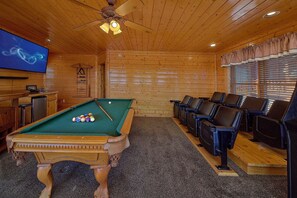 A pool table with balls, a television, and seating area with chairs. - A Glimpse of Heaven | Sweeping Mountain Views | Hot Tub (Sevierville)