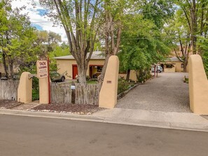A gated entrance with a sign indicating it's a vacation property. - #1 Poppy Studio @ Taos Lodging - Hot Tub+ A/C (Taos)