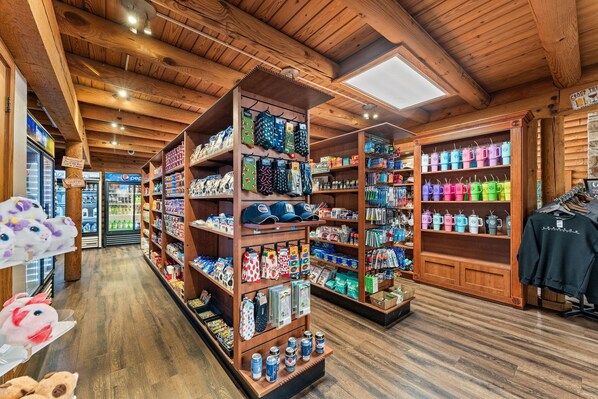 A store with wooden shelves stocked with various items, including hats, socks, and other merchandise.