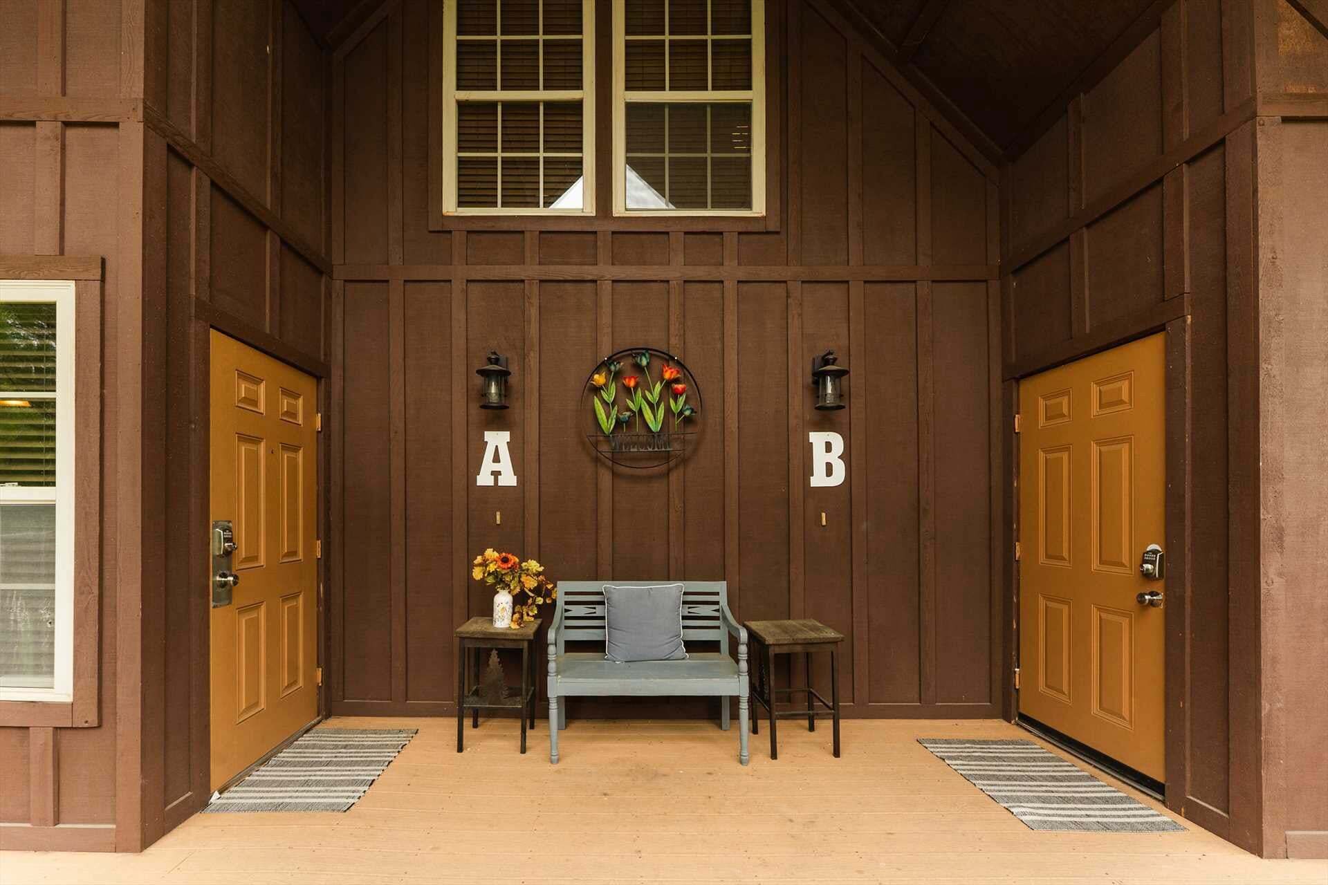A wooden hallway with two doors labeled A and B, a bench, a vase with flowers, and two wall-mounted lanterns.