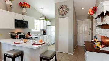 Coffee/tea maker, fridge, microwave, oven