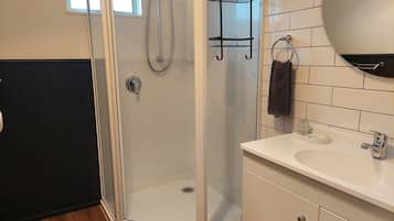 Apartment, 2 Bedrooms | Bathroom | Shower, hair dryer, towels, soap