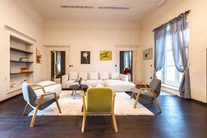 A living room with a sofa set, two armchairs, a coffee table, and a bookshelf. - Villa Tihomira - Private villa with pool, Dalmatia (Zaton)