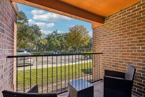 A balcony with a brick wall, a metal railing, and outdoor furniture. - Entire rental unit in Gainesville, Florida
10 guests4 bedrooms4 beds4 baths (Gainesville)