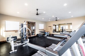 A gym with treadmills, weight machines, and free weights. - Private Backyard & Hot Tub | Minutes to Deer Valley, Jordanelle & Park City (Kamas)