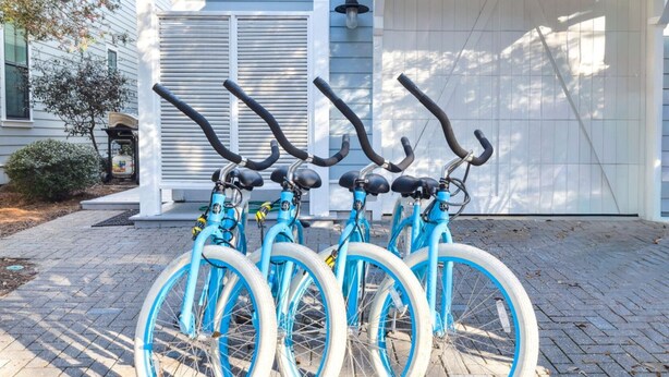 Three bicycles parked in front of a house with a garage. - Easy Walk 2 Beach! Private Pool, LSV/Golf Cart & Bikes! (Santa Rosa Beach)