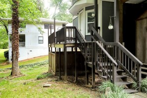 A residential property with a wooden deck, a staircase, and a porch. - Colony Home for Family Groups - Patio, Workspace (Marietta)