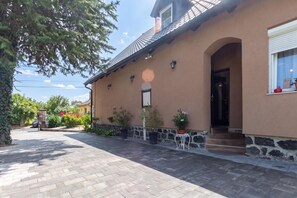A house with a stone foundation, a tiled roof, and a front door. - Hunters Lodge 1 Lake Balaton, Badacsony Wine Region, Badacsonytomaj, Hungary (Badacsonytomaj)