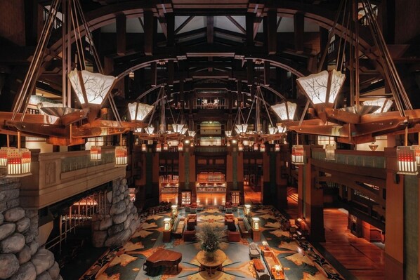 A spacious lobby with a high ceiling, large windows, and a central seating area. - Anaheim | Romantic Disney Retreat | Pool + Spa (Anaheim)