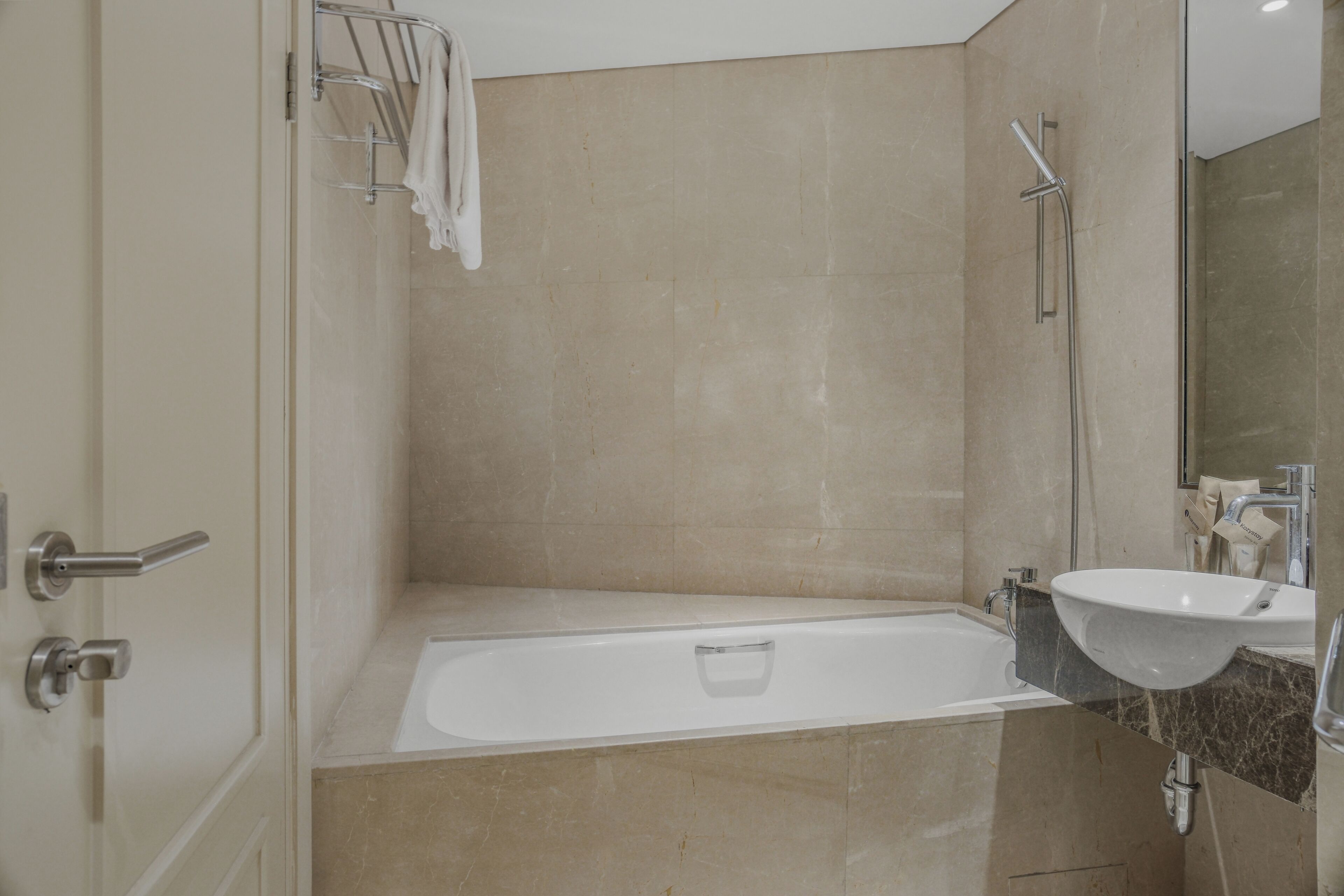 A bathroom with a bathtub, a sink, and a shower.
