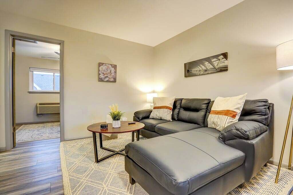 Living room with entrance to Bedroom in the background