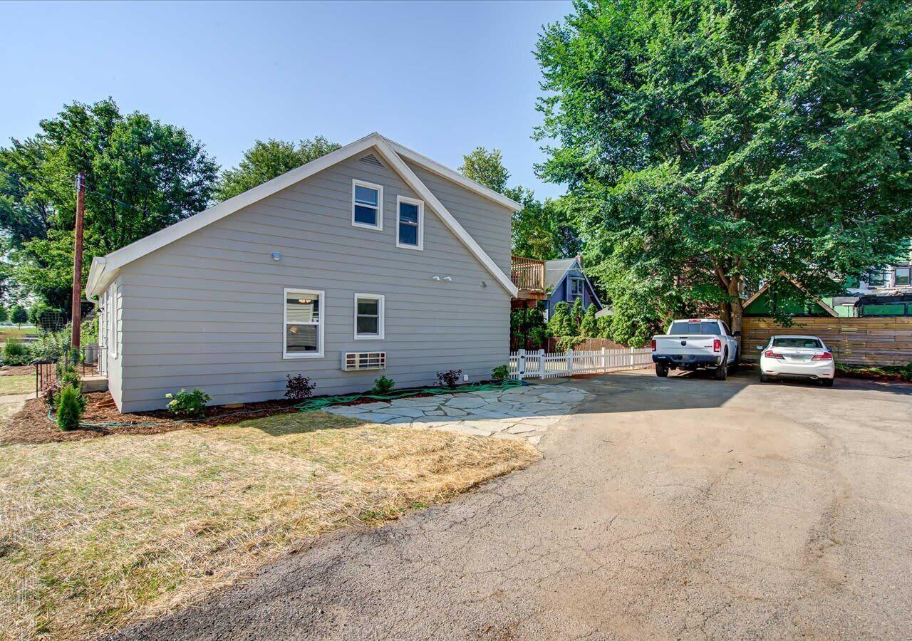 Rear parking area with one designated spot included for guests. Additional vehicles can use nearby street parking where permitted, providing convenient access to the property.