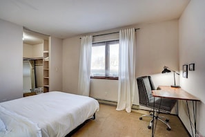 Bedroom. Work desk on the right and huge walk in closet on the left. - Walk to UW Hospital | Free Parking & WiFi (Madison)