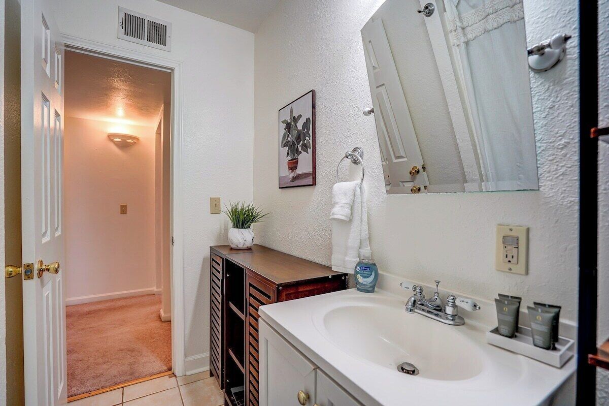Bathroom. Extra storage cabinet near the door.