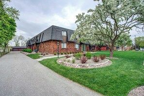 
Charming brick exterior with mature landscaping and lush green lawn, offering a peaceful and welcoming entry to your home.