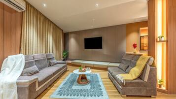 Suite superior | Área de sala de estar