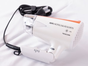 A white hair dryer with a black cord and a clear protective cover. - APA Hotel Shibuya Ekimae (Tokyo)