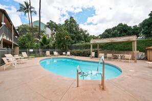 A swimming pool with lounge chairs and a pergola. - Oceanfront 2BR | Two Lanais, Turtles & Sunsets (Lahaina)