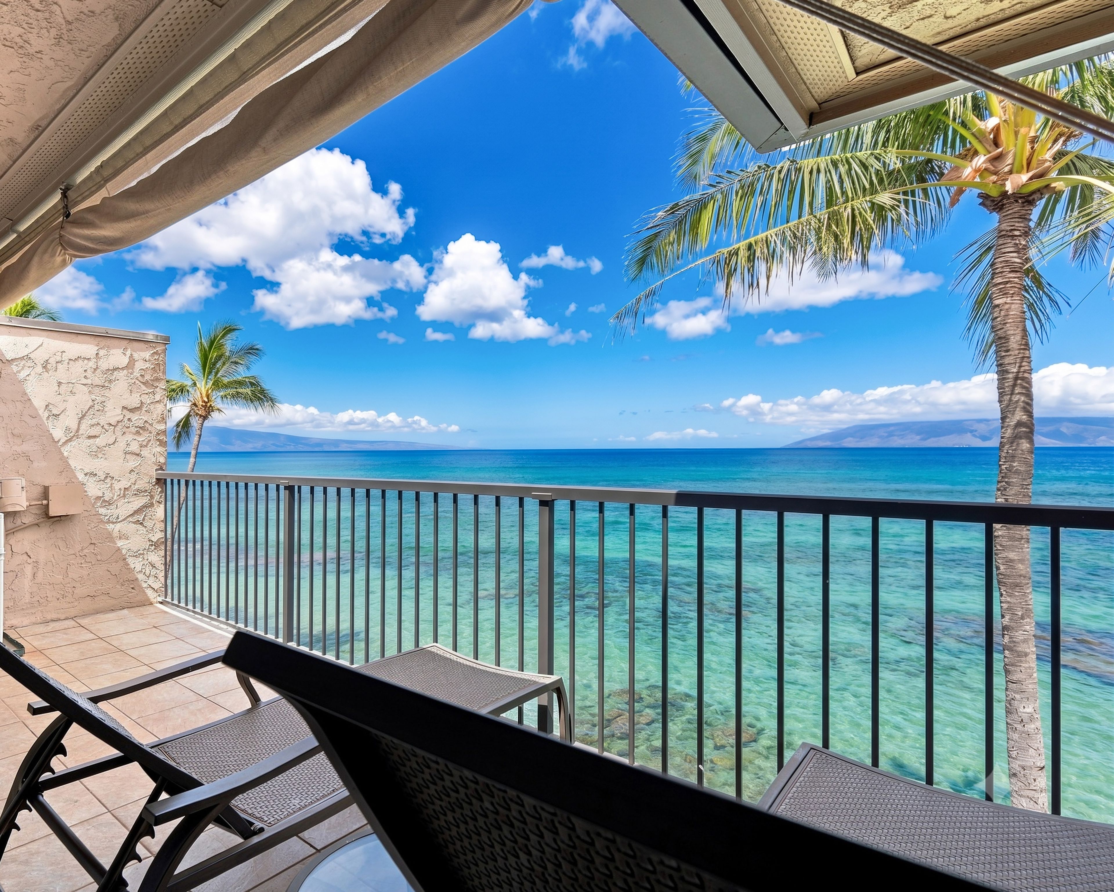 Wake up and step outside to the primary bedroom’s ocean-view lanai.