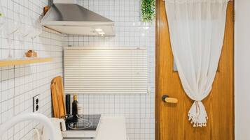 Microwave, cookware/dishes/utensils, spices, dining table