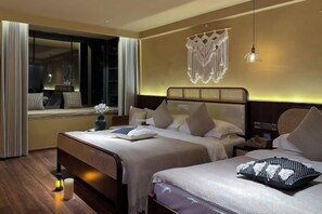 A hotel room with two beds, a large window, and a decorative wall hanging. - View of the Sea Vatican (Dali City)