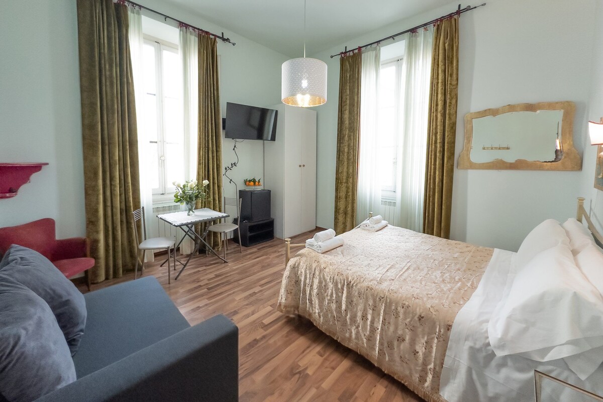 Family Quadruple Room, City View | Hypo-allergenic bedding available, down comforters, in-room safe, desk